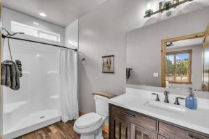 a bathroom with a toilet and a sink and a shower at East Zion Trails Retreat-Hot tub, Resort Amenities, Exceptional in Orderville +55 photos