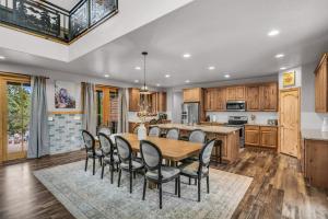a kitchen and dining room with a wooden table and chairs at East Zion Trails Retreat-Hot tub, Resort Amenities, Exceptional in Orderville