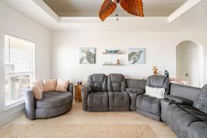 a living room with a couch and two chairs at Beachfront Fire Pit Gourmet Kitchen Views in Bolivar Peninsula