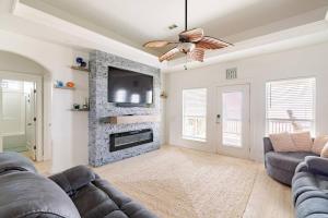 a living room with a couch and a fireplace at Beachfront Fire Pit Gourmet Kitchen Views in Bolivar Peninsula
