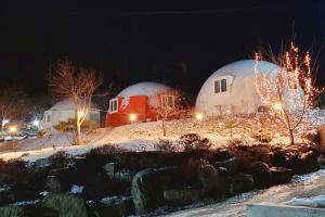 two domes in the snow at night at Wonju Forest Dome in Wonju