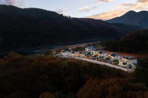 an aerial view of a town next to a river at Chuncheon DBJ in Chuncheon