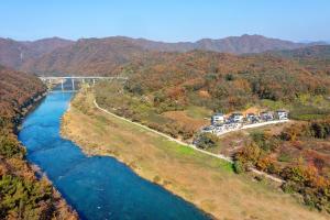 an aerial view of a bridge over a river at Chuncheon DBJ in Chuncheon