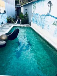 a swimming pool with an inflatable at Villa 49 in Abidjan