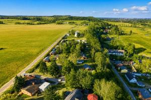 an aerial view of a village with houses and trees at Inselglück Usedom in Kamminke