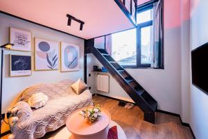 a small room with a bed and a staircase at Beijing xiyou hotel in Beijing
