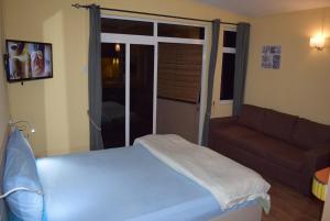 Postel nebo postele na pokoji v ubytování Baywatch Apartment