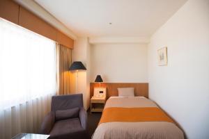 Rúm í herbergi á Hotel Granmirage