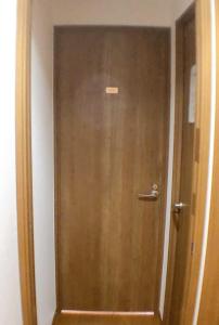 a door with a sign on it in a room at HOSTEL198 Private Room of Third floorーVacation STAY68050v in Osaka