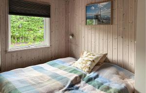 a bedroom with a bed and two windows at Nice Home In Børkop With Wifi in Børkop