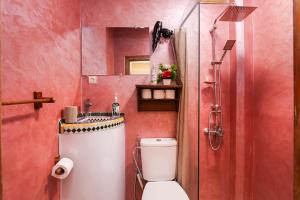 a bathroom with a toilet and a sink and a shower at Dar Houda in Fez +32 photos