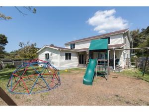 a playground with a slide in front of a house at TEA TREES - Vacation STAY 86532v in Tateyama