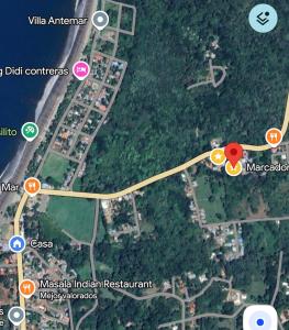 a map of a road with a red circle at Apartamentos Aledu in Brasilito