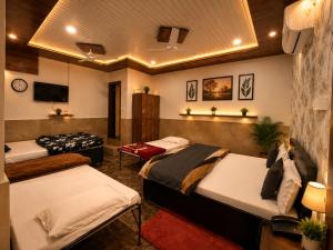 a bedroom with two beds in a room at The Kishan's Nest in Mathura