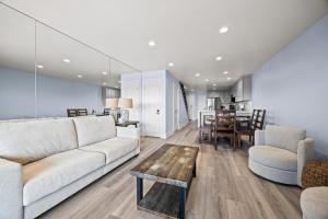 a living room with a couch and a table at Seascape Ocean View Condo in Aptos