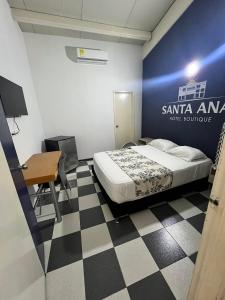 a bedroom with a bed and a desk and a table at Hotel Boutique Santa Ana in Cartago +70 photos