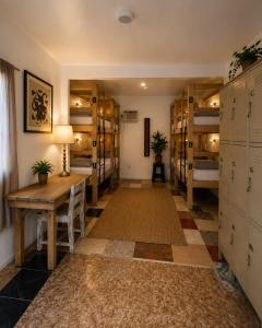 a room with a bunch of bunk beds at Casa Alegria Beach Rooms in Alegria +10 photos