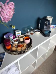 a table with a tray of food and a coffee maker at Laimhrig Lockley in Torrin