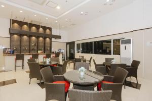 a restaurant with tables and chairs and a bar at Toyoko Inn Cebu in Cebu City