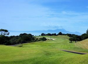 a view of a golf course with a green field at 海しずく Slow in Amakusa