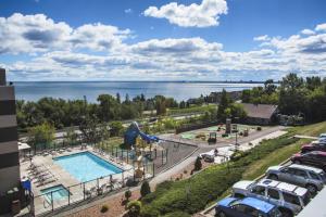 a view of a pool at a resort with a parking lot at Edgewater Hotel and Waterpark in Duluth