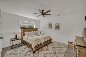 a bedroom with a bed and a ceiling fan at Copper Rock Ridge- Luxury, Pool Table, Hot Tub between Zion and Bryce in Orderville +61 photos