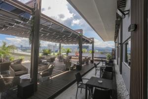 a patio with tables and chairs on a building at Toyoko Inn Cebu in Cebu City