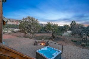 a hot tub sitting on top of a yard at Copper Rock Ridge- Luxury, Pool Table, Hot Tub between Zion and Bryce in Orderville
