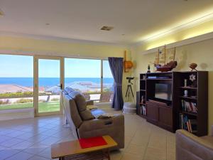 a living room with a couch and a television at Willenby in Wallaroo