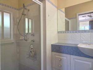 a bathroom with a shower and a sink at Willenby in Wallaroo +9 photos