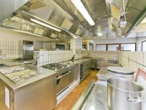 a large kitchen with stainless steel appliances at Chalet in Angerberg near SkiWelt Slopes in Angerberg