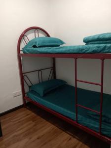 a couple of bunk beds in a room at MF Roxy Beach Townhouse Sematan Private Unit L31 in Sematan +13 photos