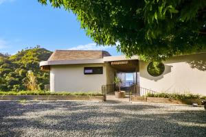 a house with a driveway in front of it at Makai Lombok in Selong Belanak