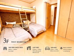two sets of bunk beds in a room with a poster at 関口ロイヤルハウス in Tokyo