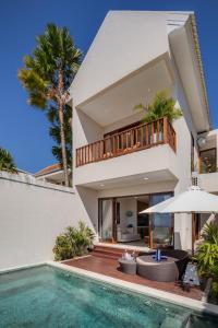 a villa with a swimming pool and a house at 1BR Ocean View Villa with Private Pool - Bingin in Bingin Beach
