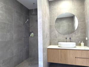 a bathroom with a sink and a mirror at Belless at Moonta Bay in Port Moonta +15 photos