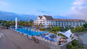 an aerial view of a resort with a large swimming pool at Lv8 Resort Hotel in Canggu