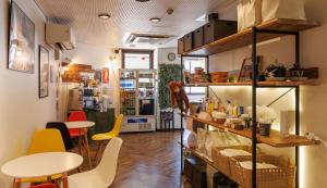 a room with two tables and chairs and a table at Hotel Nomad - Vacation STAY 73941v in Hitachi +13 photos