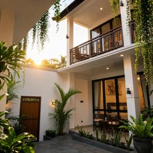 a house with plants in front of it at Pondok Biu 2 in Denpasar