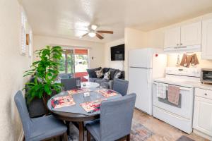 a kitchen and living room with a table and chairs at Cozy Lakefront Home in Lake Wales