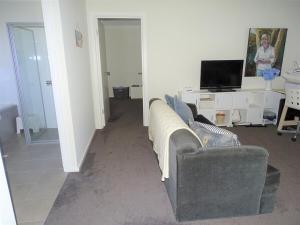 a living room with two couches and a television at Ripplesea in Port Moonta