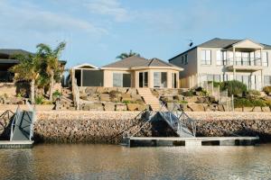 a house next to a body of water at The Stately Way in Wallaroo
