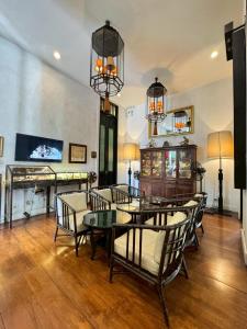 a dining room with a table and chairs at 99 The Gallery Hotel in Chiang Mai +39 photos