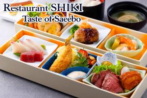 a tray filled with different types of food at ART HOTEL Sasebo Central in Sasebo +68 photos