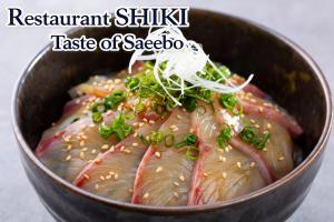 a bowl of meat with sesame seeds on top of it at ART HOTEL Sasebo Central in Sasebo