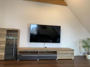 a flat screen tv sitting on a wall at grosser-Fiete in Wittdün