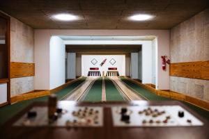 a bowling alley with lanes and balls on the floor at Der Sunderhof in Seevetal