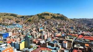 an aerial view of a city with buildings at Andenes Puno in Puno +13 photos