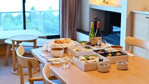 a table with boxes of food and bottles of wine at ジローズガーデン in Ishinomaki +37 photos