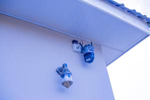 a pair of shoes hanging from a roof at CAM Apartments in Dodoma +1 photo